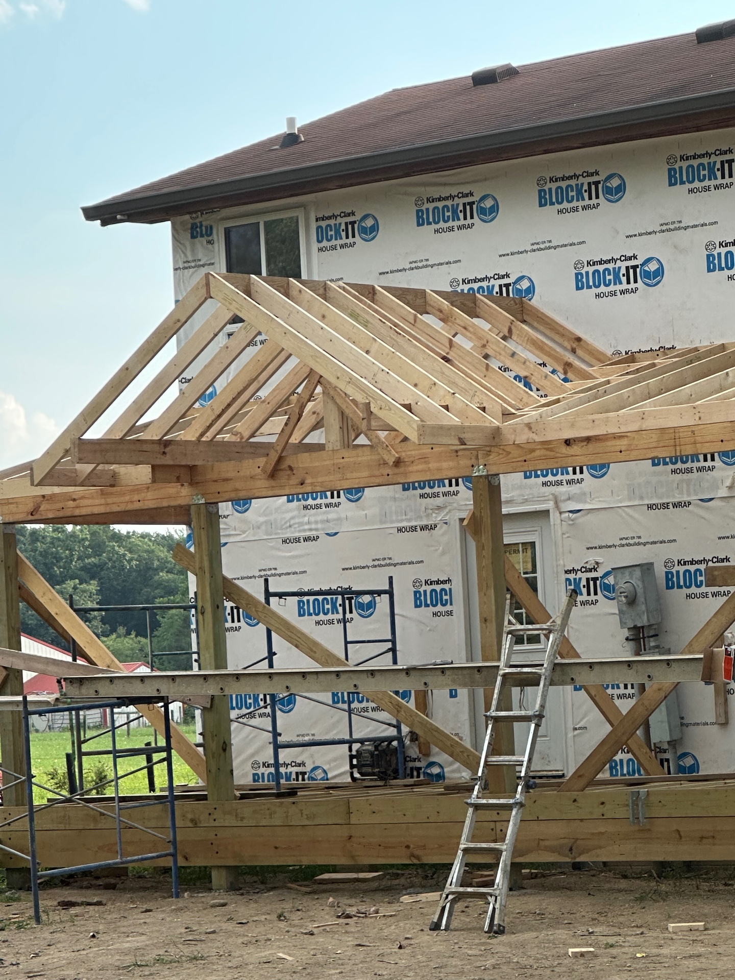 Porch roof framing and rafters on a home addition