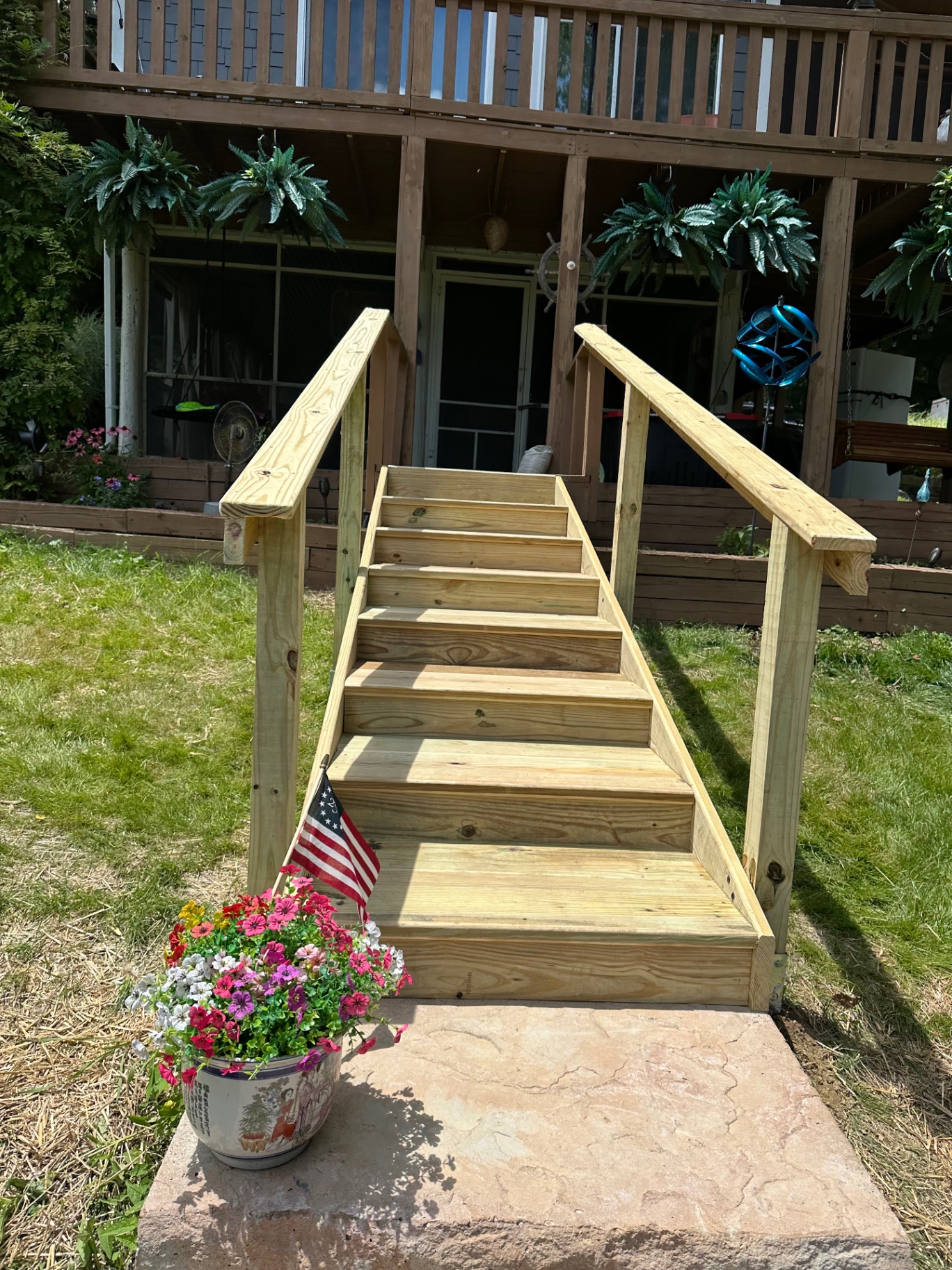 Completed wood stair build with double handrails