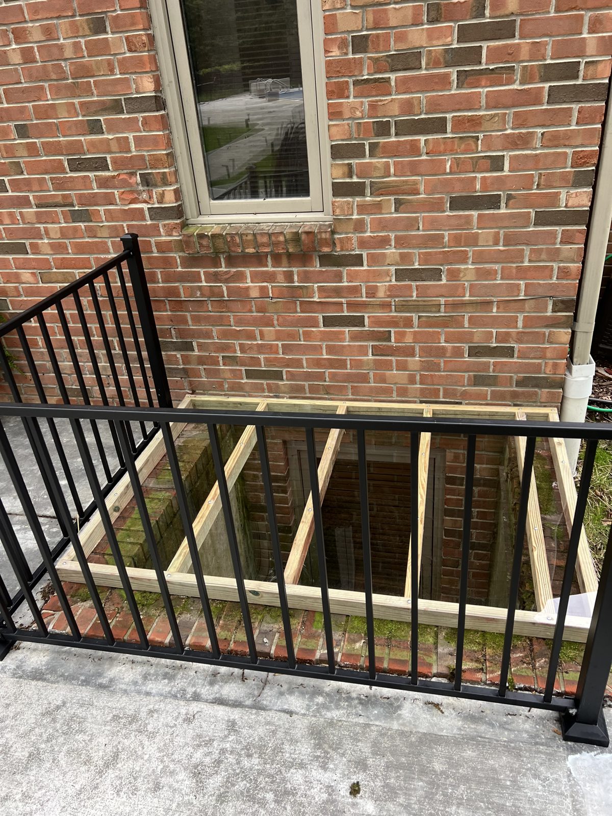 Basement window cover construction