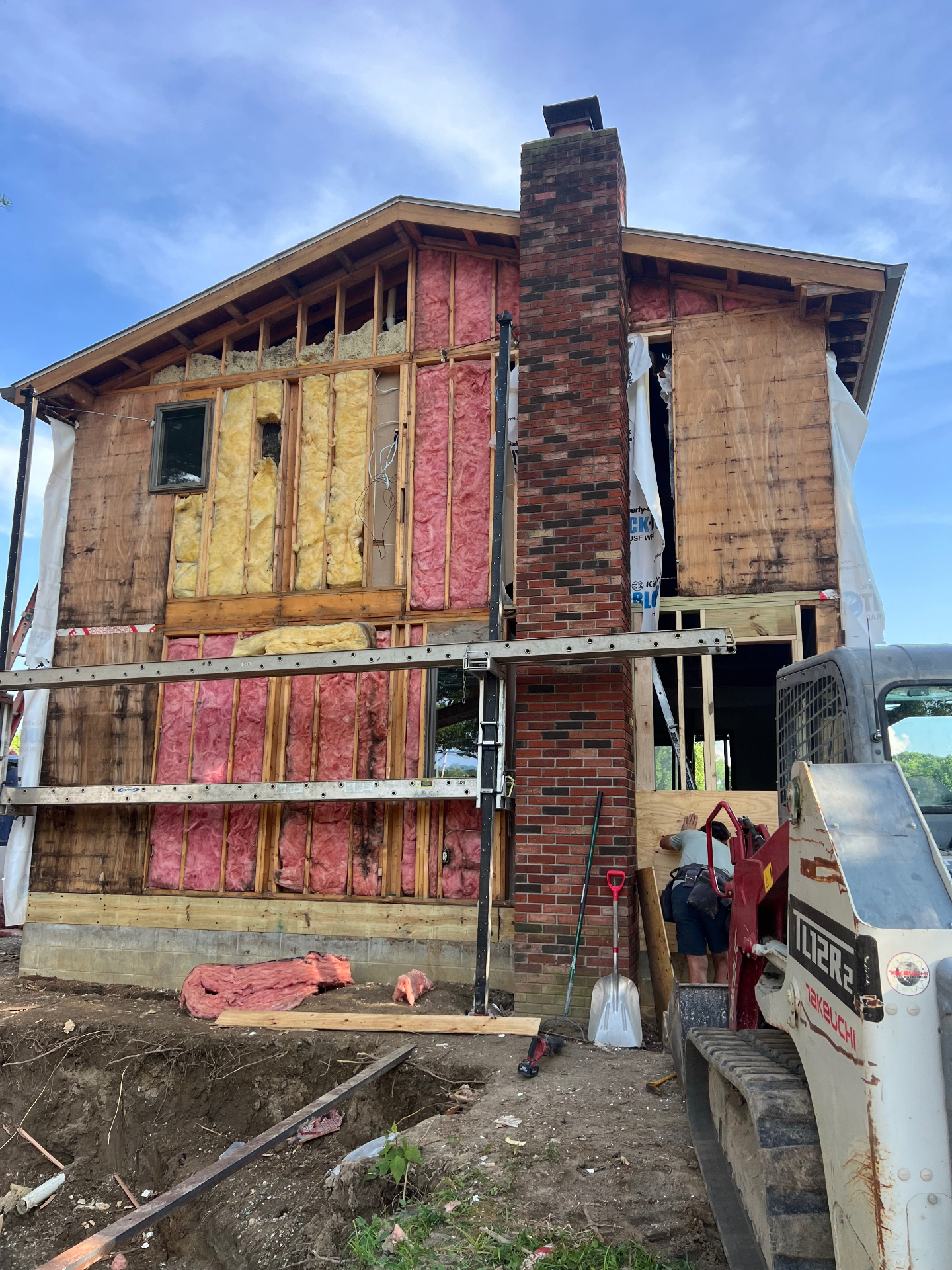 Exterior wall opened up for rot removal and new framing