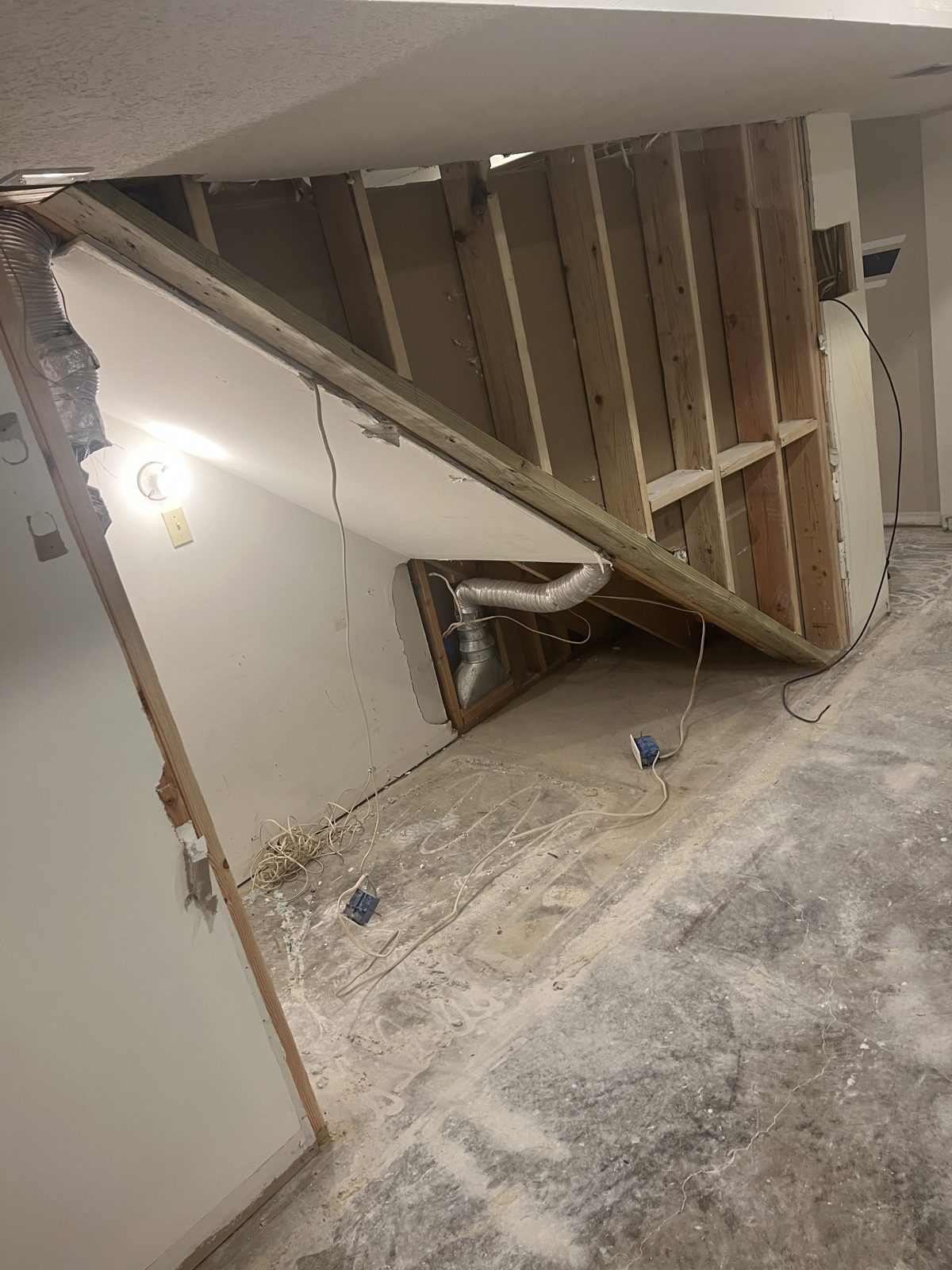 Q&Q crew framing interior beams on a renovation project