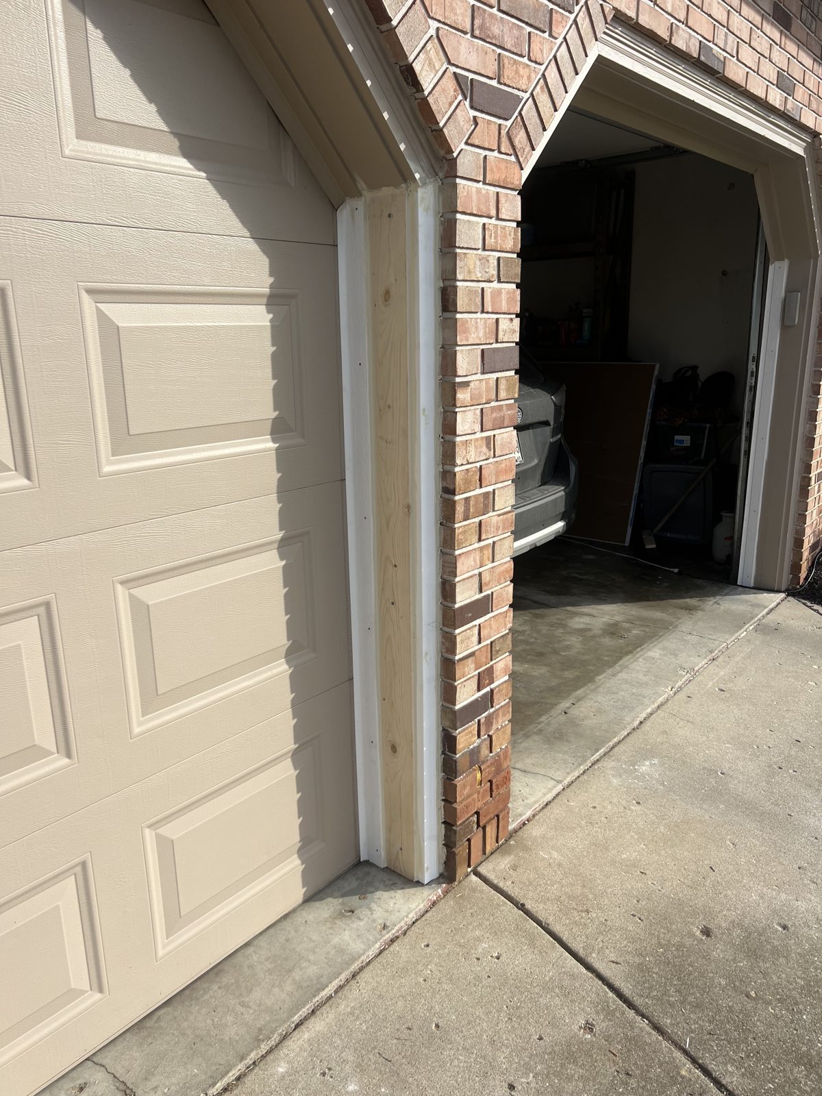 Garage door trim repair — before