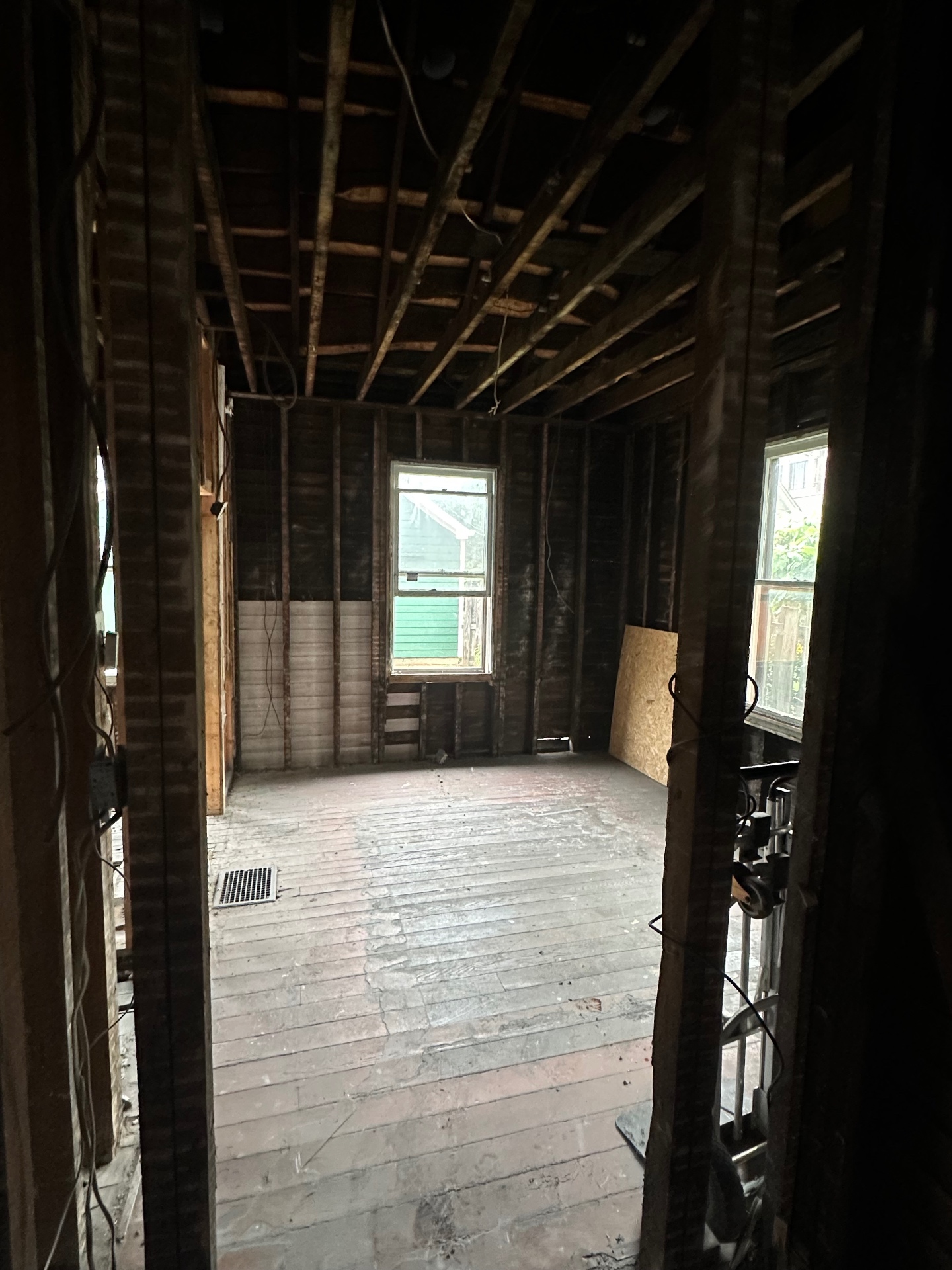Same bedroom gutted to the studs and subfloor